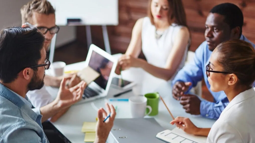 group of workers around table