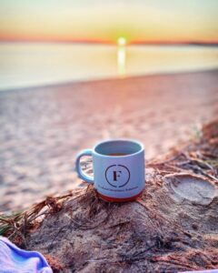 coffee mug on beach